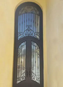 Cathedral style wrought iron door in Huntington Beach, CA