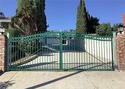 Green Iron Wing Gate with Rings and Bell Arch Montebello CA