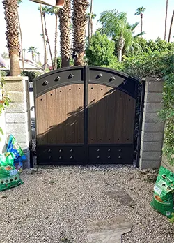 Iron & Wood Swing Gate with Kickplate and Arch Kickplate Palm Desert CA