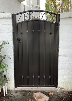Bronze Iron Gate with Sheet Metal, Knuckles, and Scrolls Coto De Caza CA